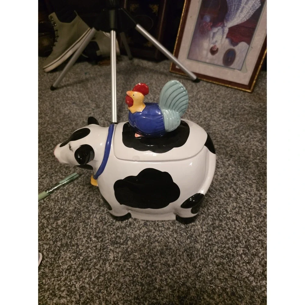 Cow Cookie Jar With Rooster Lid. Small Chip On Lid And Some Red Has Rubbed Off.